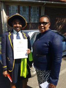 Isheanesu Mahachi and Mrs Mukogo at Arrupe college Harare isheanesu came 1st in an essay writing  competition